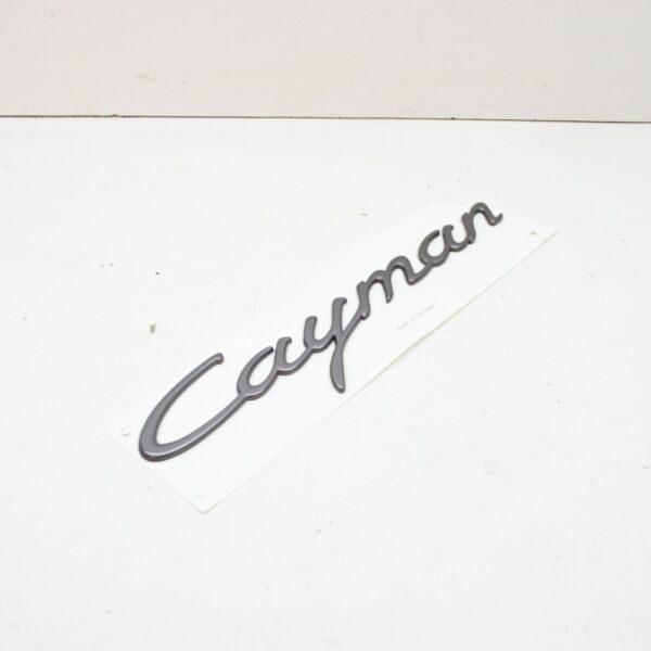 98755923900 - PORSCHE CAYMAN 987 Rear Hatch Emblem 98755923900 ORIGINAL