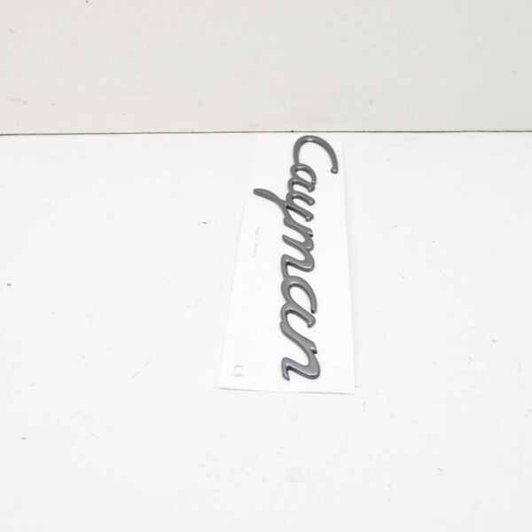 98755923900 - PORSCHE CAYMAN 987 Rear Hatch Emblem 98755923900 ORIGINAL