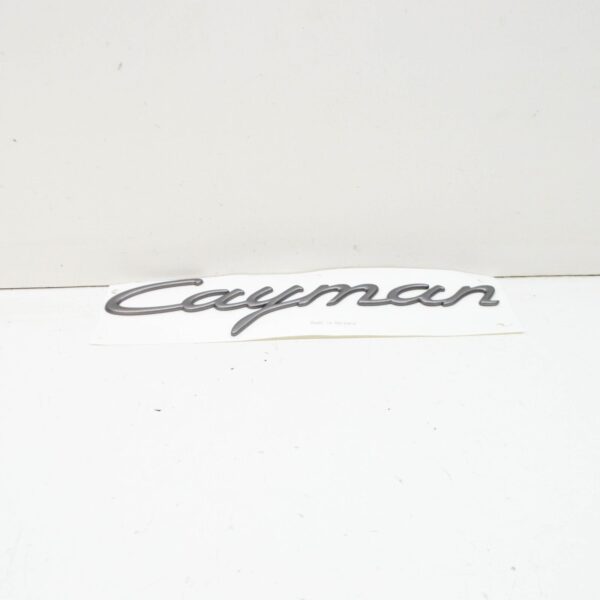 98755923900 - PORSCHE CAYMAN 987 Rear Hatch Emblem 98755923900 ORIGINAL
