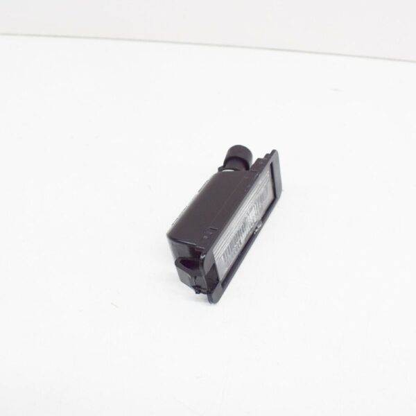 1JE943021A - NEW VOLKSWAGEN FOX LICENSE PLATE LIGHT 1JE943021A ORIGINAL