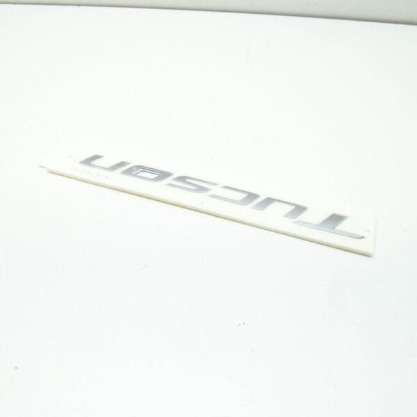 86310N9000 - Hyundai Tucson NX4 MK4 Tailgate Emblem 86310N9000, Original Part