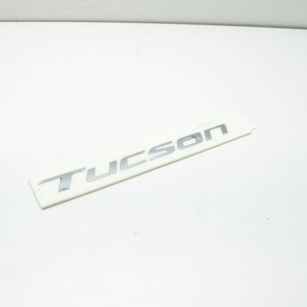 86310N9000 - Hyundai Tucson NX4 MK4 Tailgate Emblem 86310N9000, Original Part